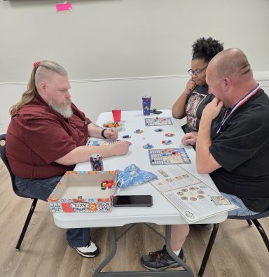 Board Game Olympics: Azul Three players play Azul at a table